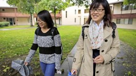 University of California, Davis freshmen Guan Wang, right, and Tracy Chen walk to class.